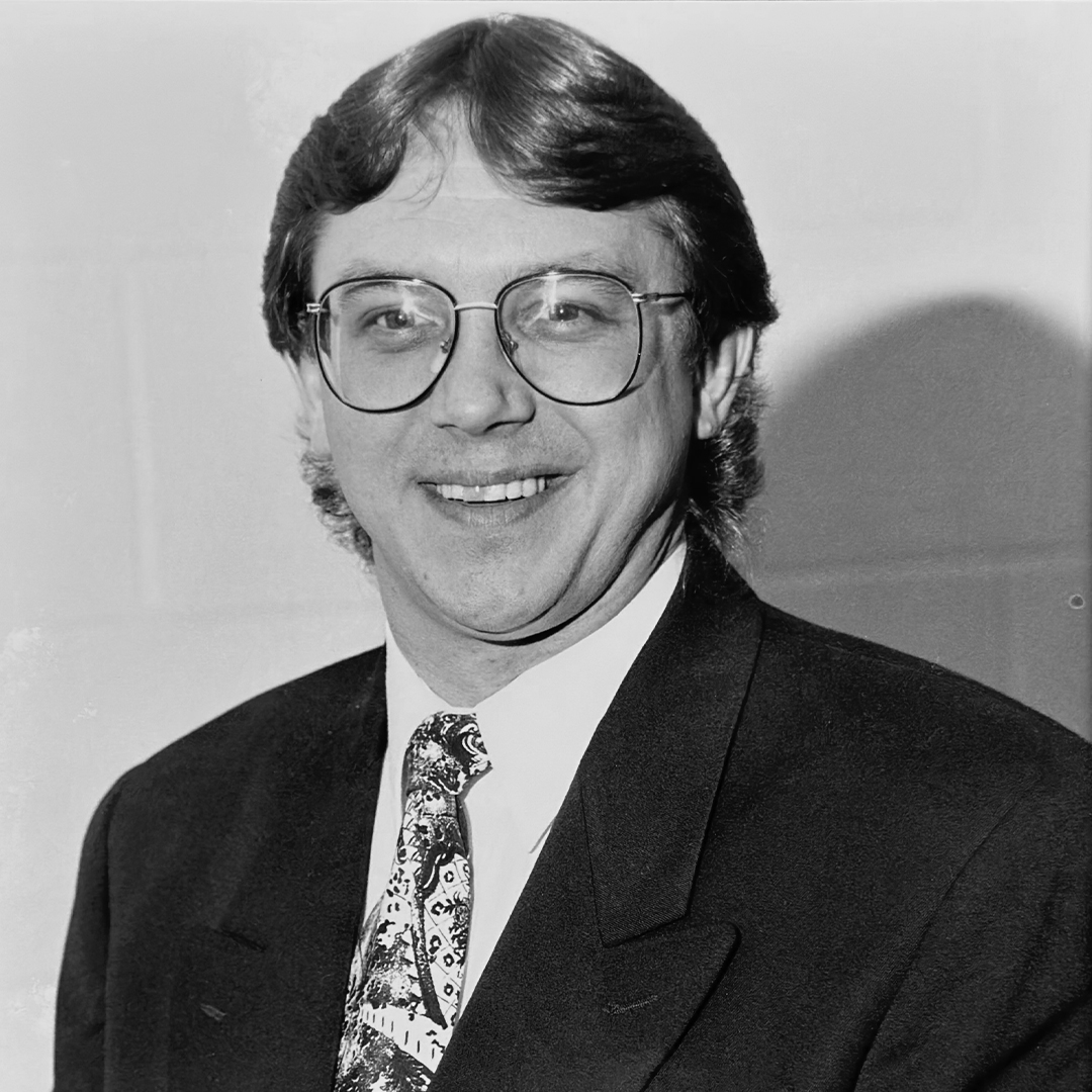 A black and white headshot of Dana Saunders. 