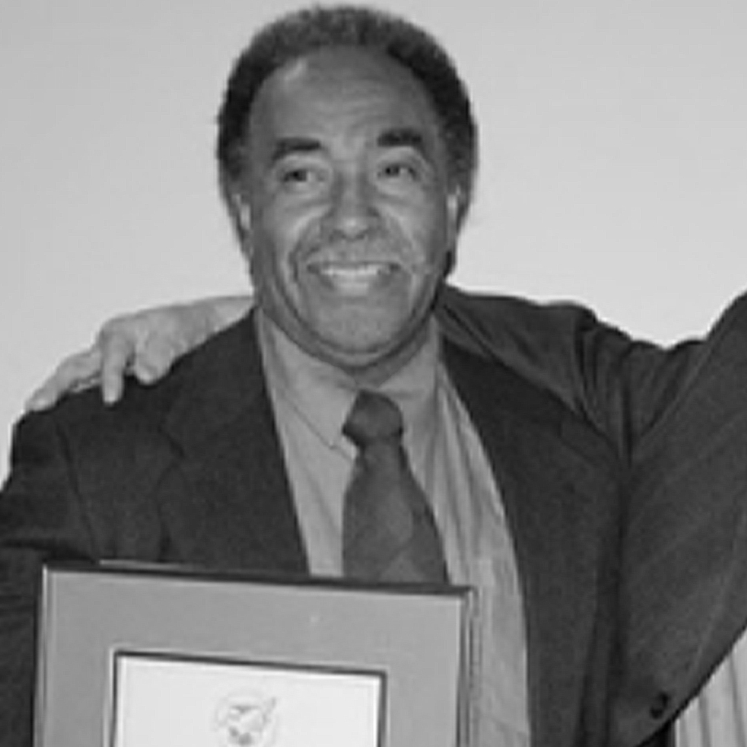 A black and white headshot of Duane Shadd. 