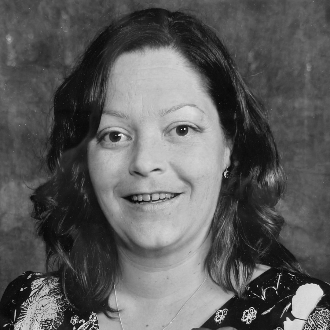 A black and white headshot of Fawn Day.