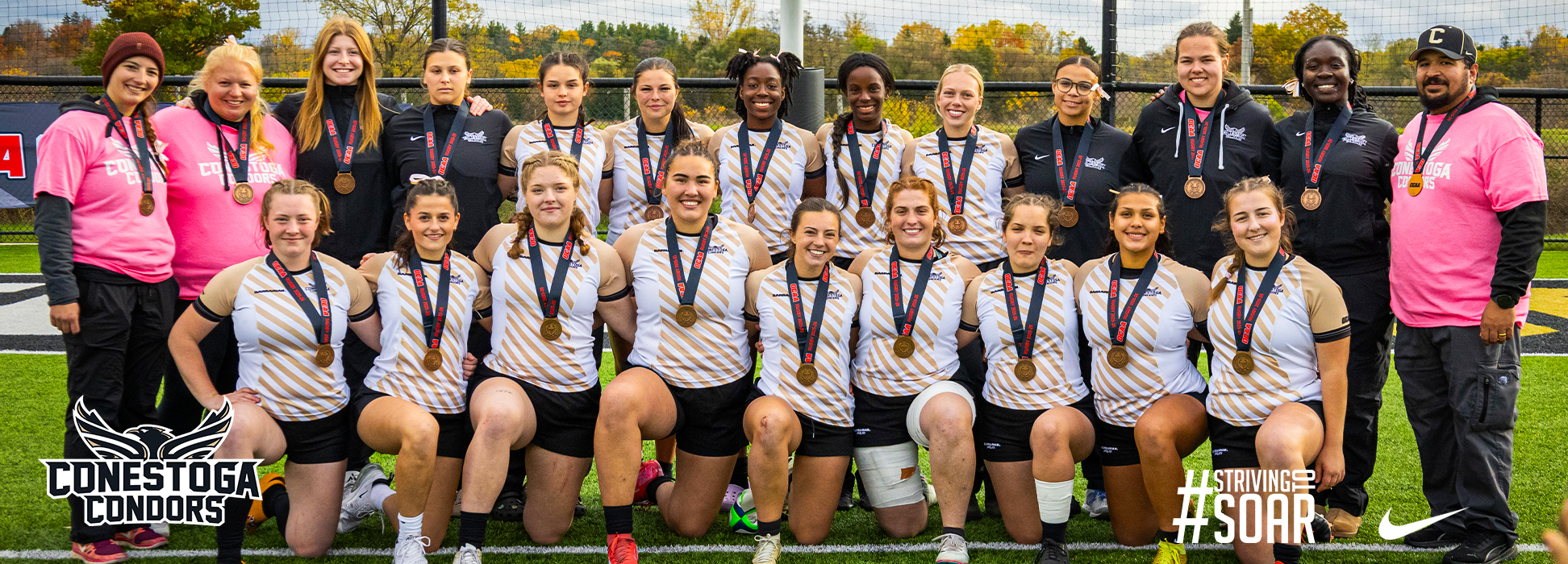 A photo banner of the women's rugby team wearing their OCAA Bronze Medals. 