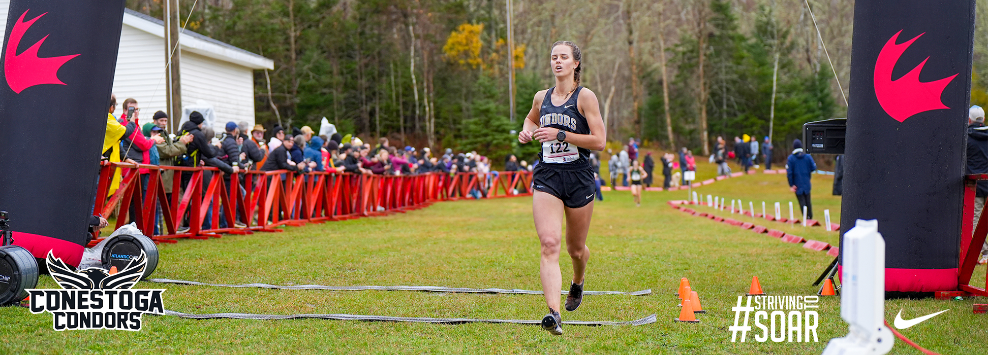 A photo banner of Dianne DeBoer crossing the finish line of the 2025 CCAA National Championship in PEI. 