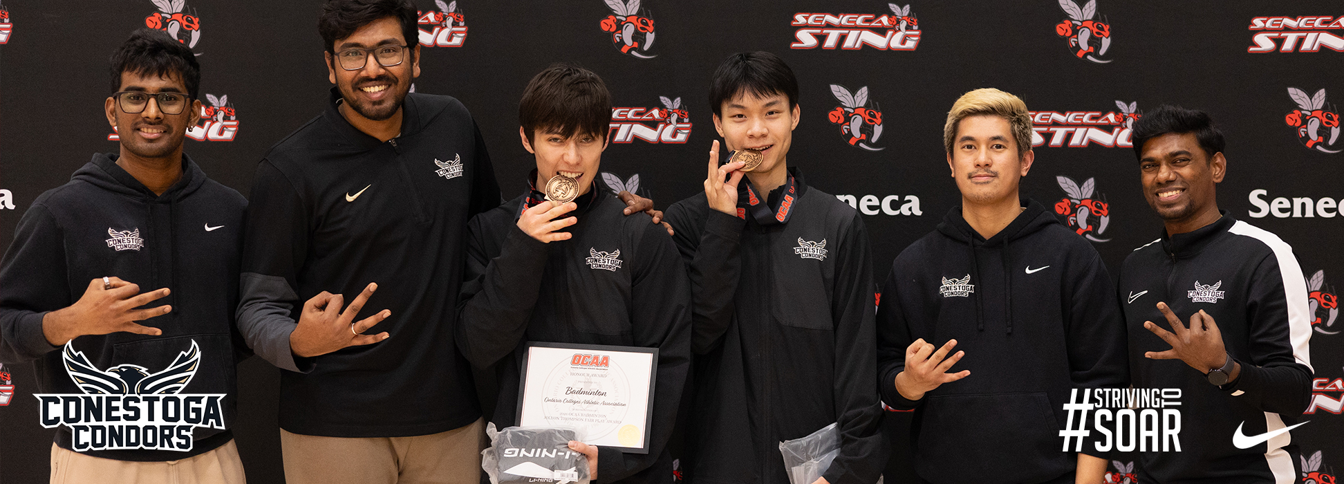A photo banner with the Condors badminton team celebrating their bronze medal win in mens doubles. 